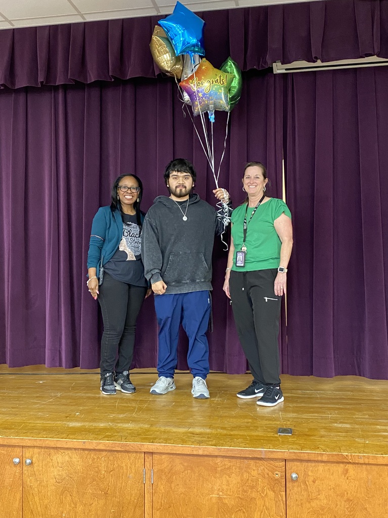 Staff member of the year with Principal and Assistant Principal.