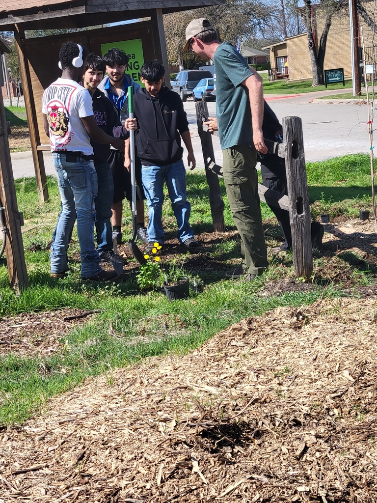 students panting natives at the garden.