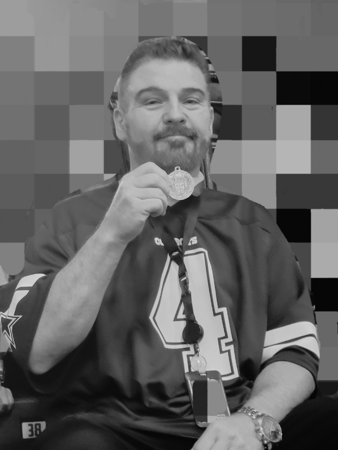 man holding medal 