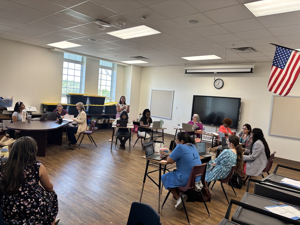 Teachers and staff attending professional development.
