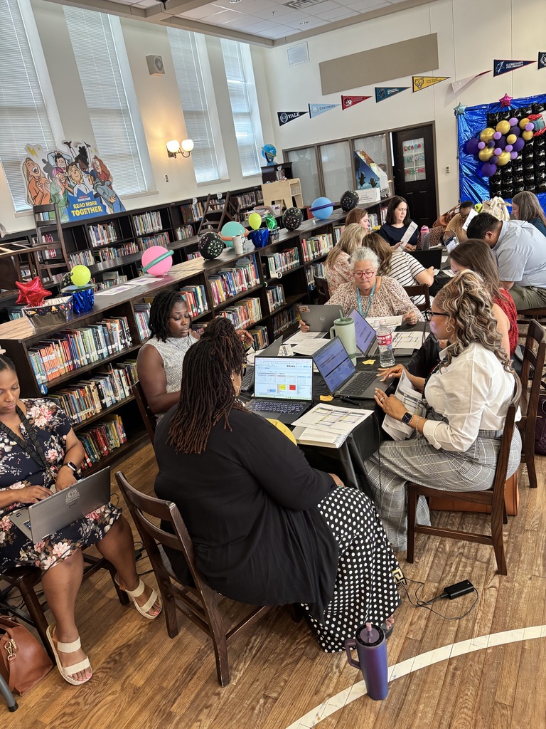 Teachers and staff attending professional development.