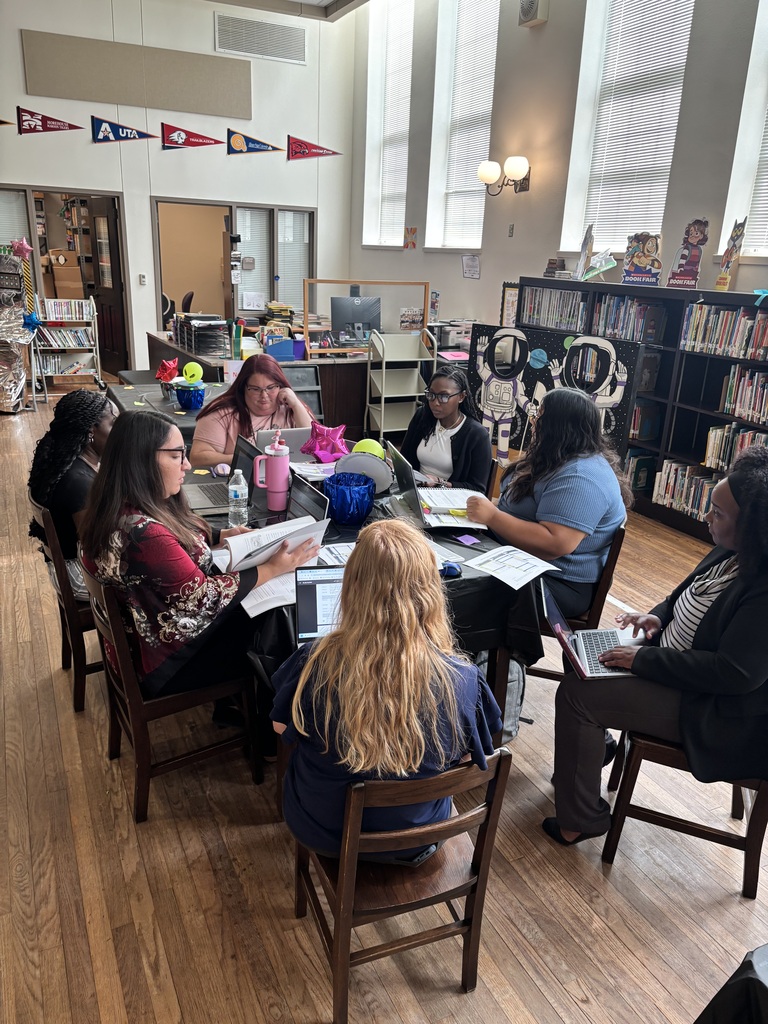 Teachers and staff attending professional development.