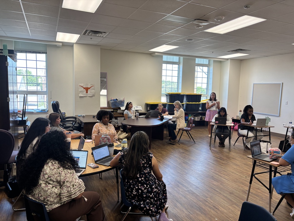Teachers and staff attending professional development.