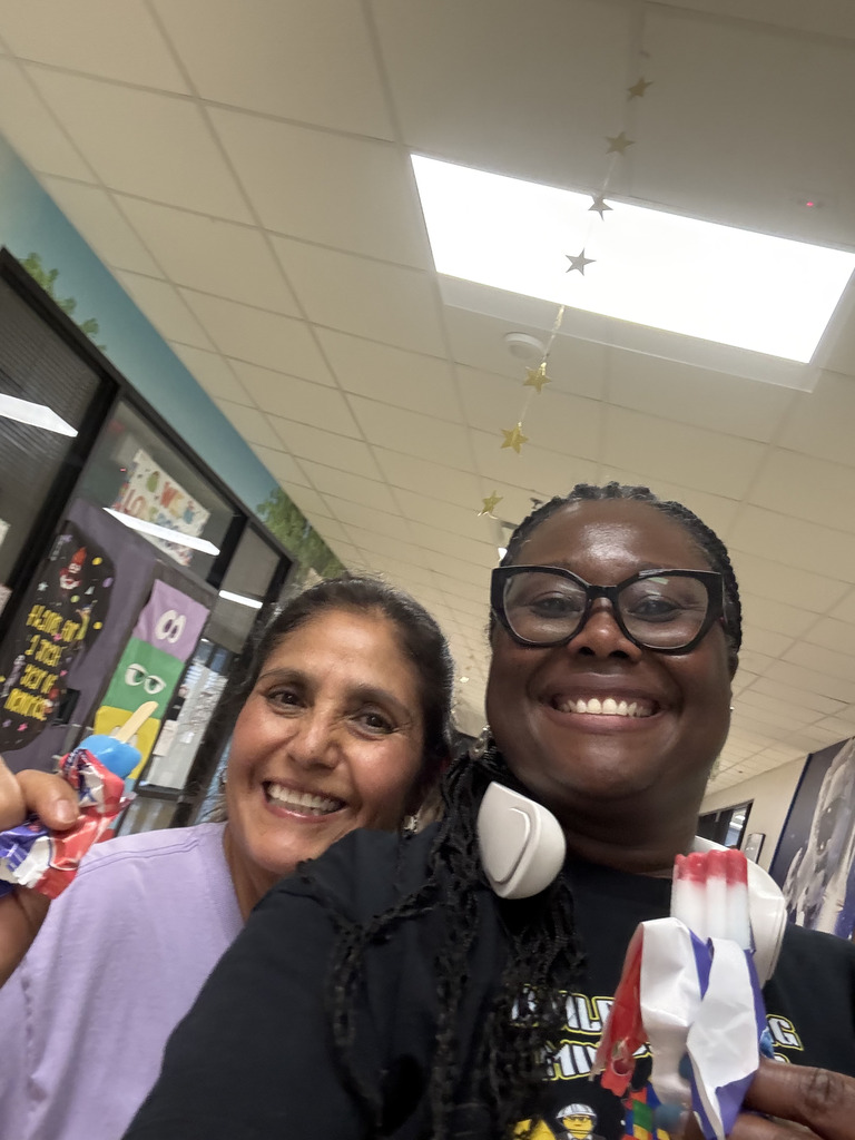 Two teachers with popsicles. 