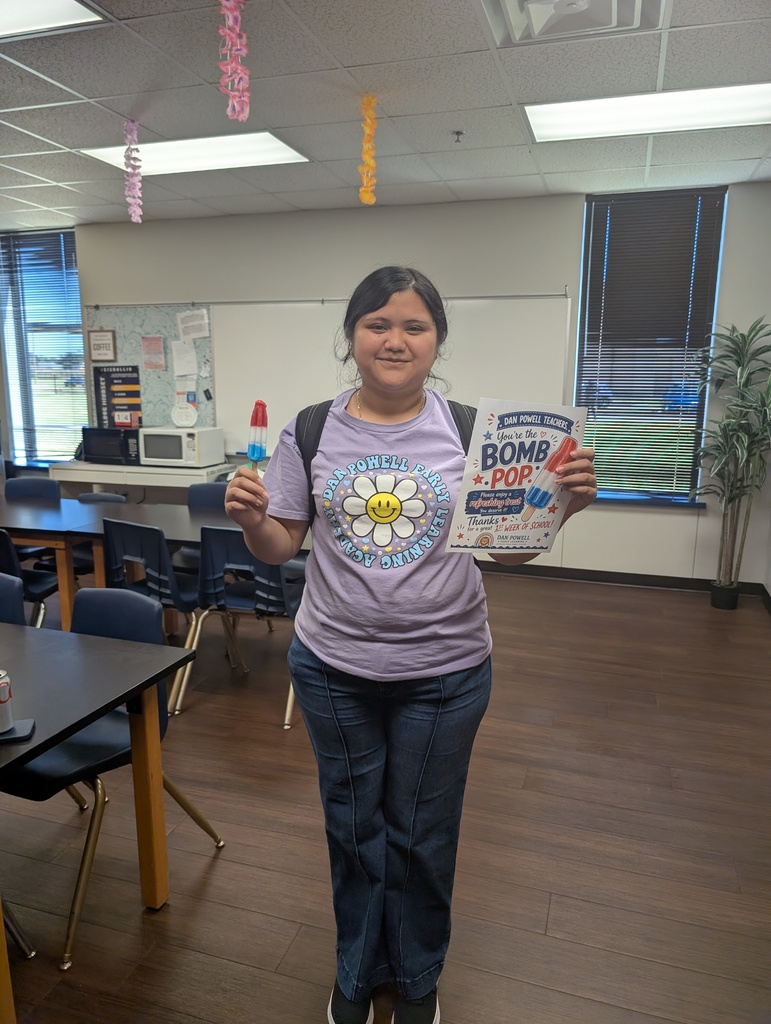 Teacher with popsicle and flyer. 