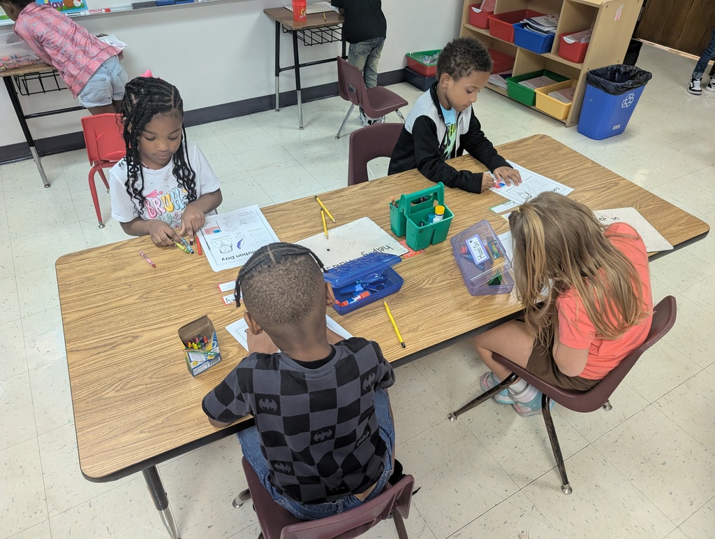 Students writing about being good citizens.
