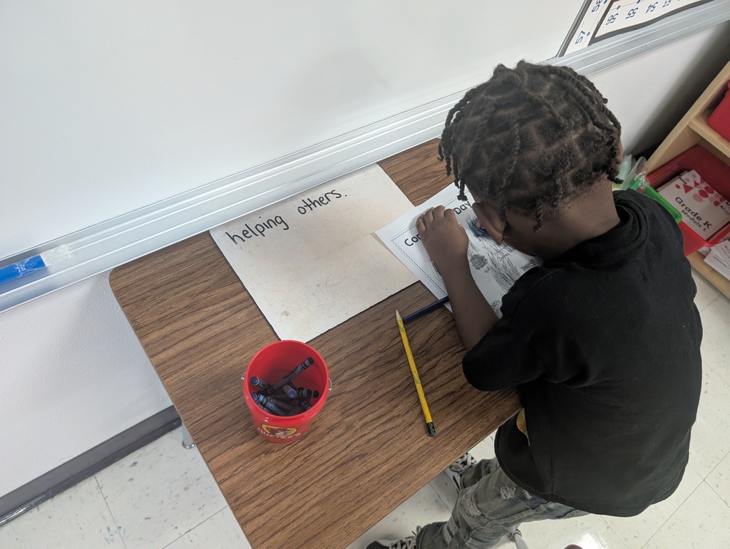Student writing about helping others. 