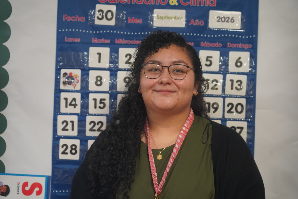 Everman ISD+Adriana Escobedo smiles for her photo in her classroom 