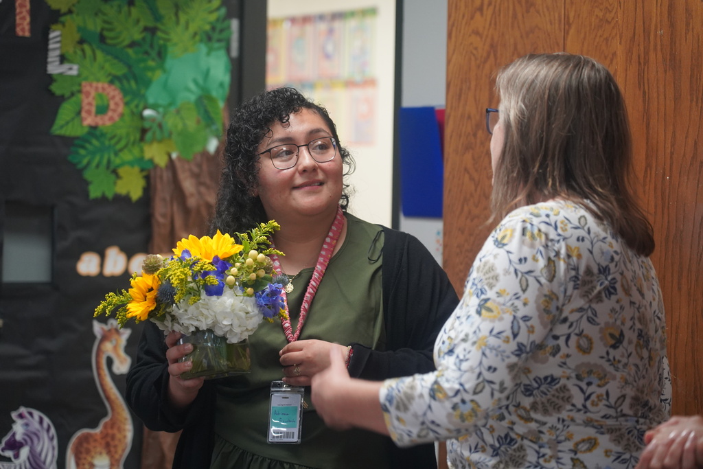 Everman ISD+ another angle Adriana Escobedo receives her flowers for the directors, accepting her flowers  as a 2025-2026 Clinical Teacher of the Year recipient