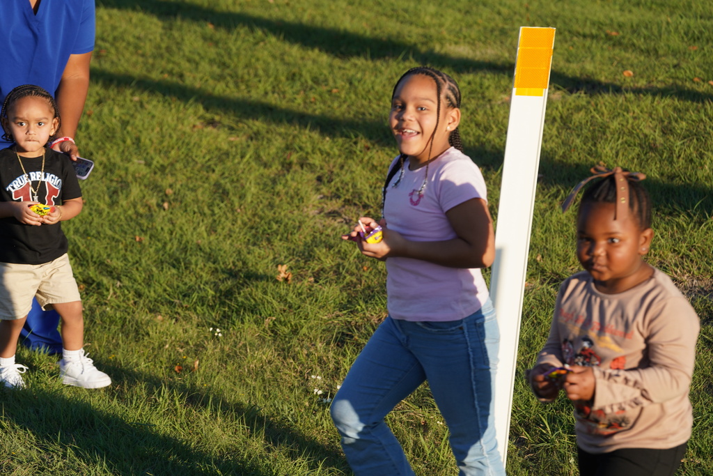 Everman student smiling with candy 