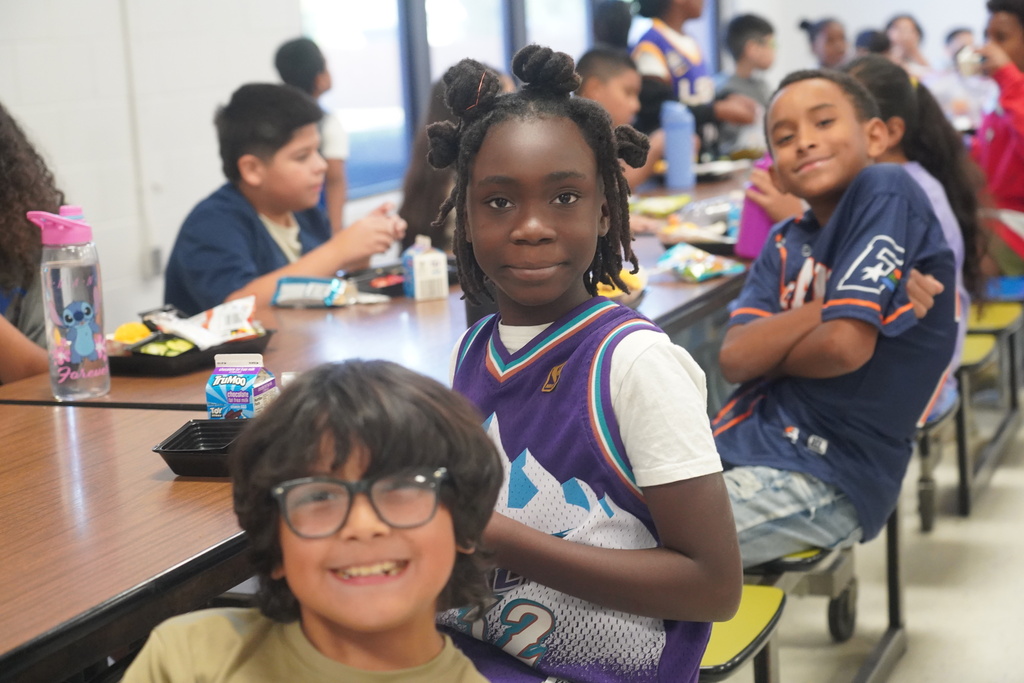 Everman ISD+ Kids posing for red ribbon week picture with sports jerseys 