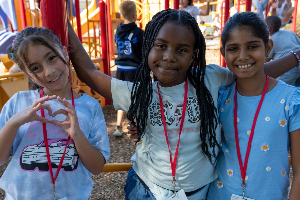 three girls on a playground
