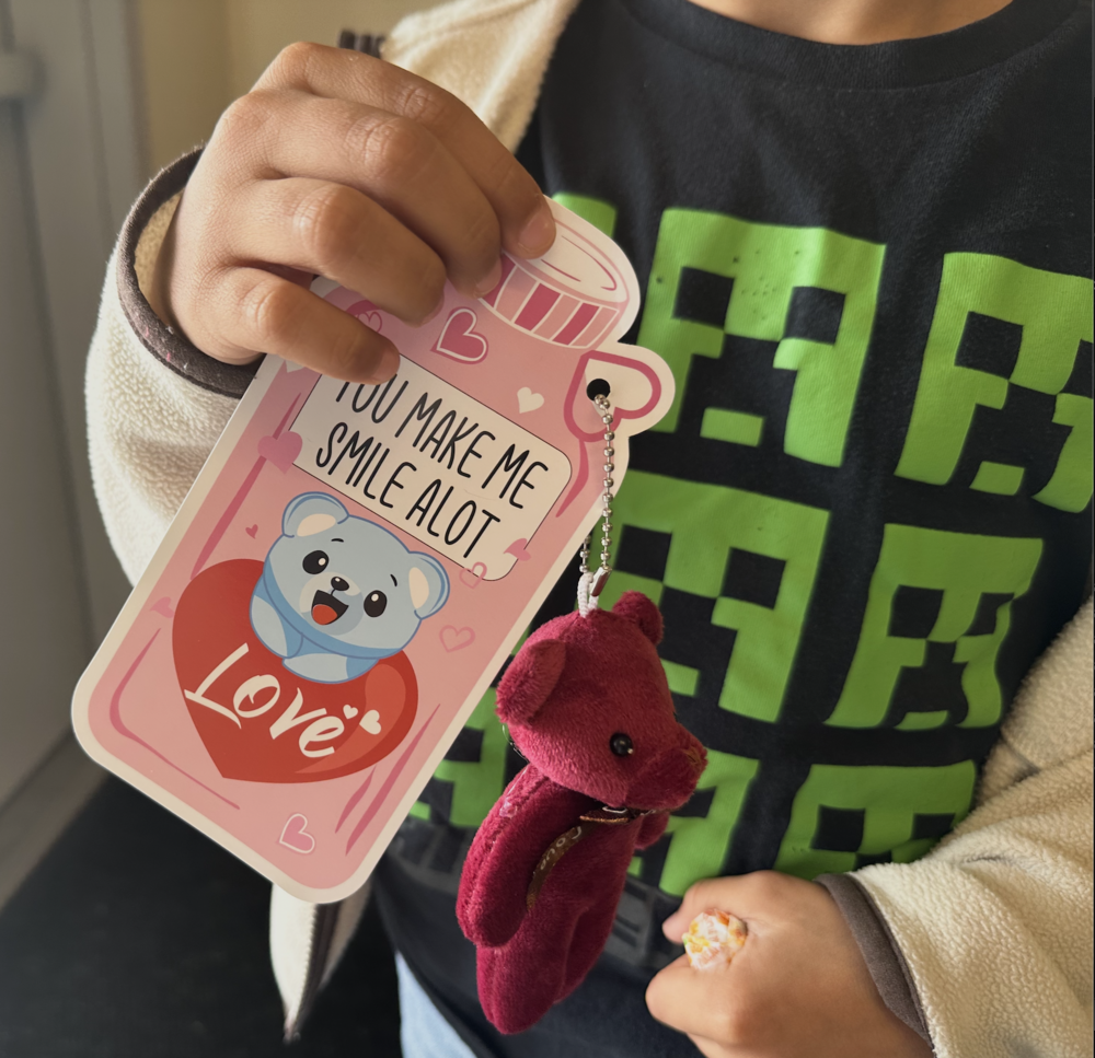 Student holding valentine card.