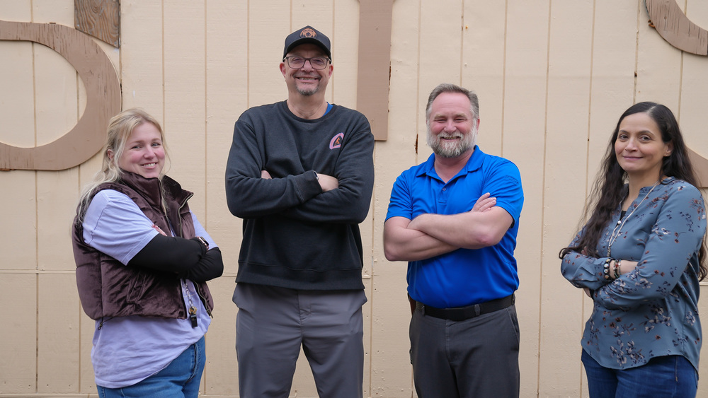 John McMorris, Principal of Sem Yeto High School, and four other teachers posing for a photo.