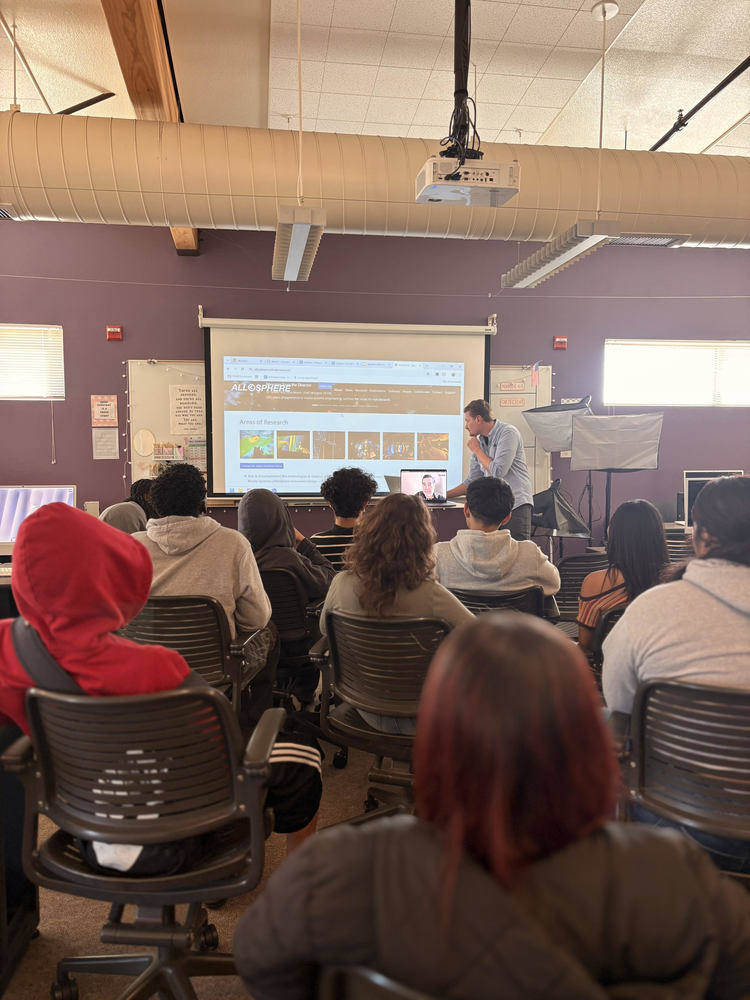 students sitting in a classroom in multimedia class