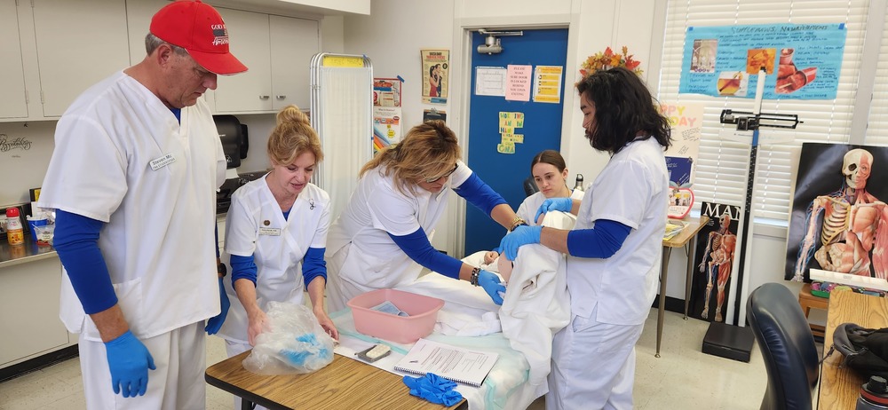 A group of CNA students  doing CNA activities