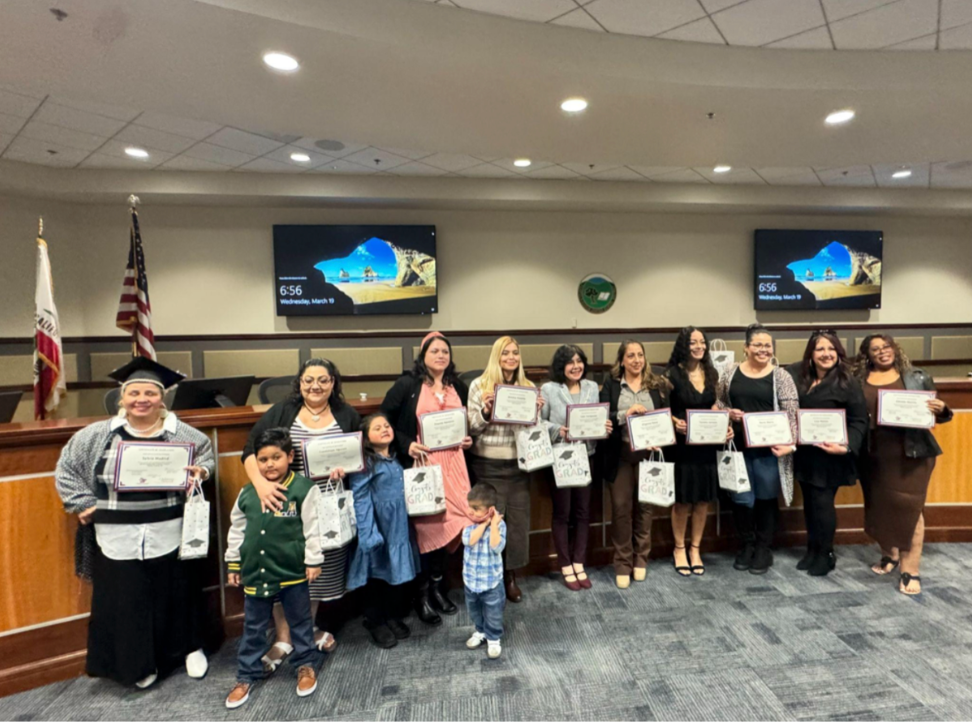 The Parent Leadership Training graduates taking a photo during graduation.