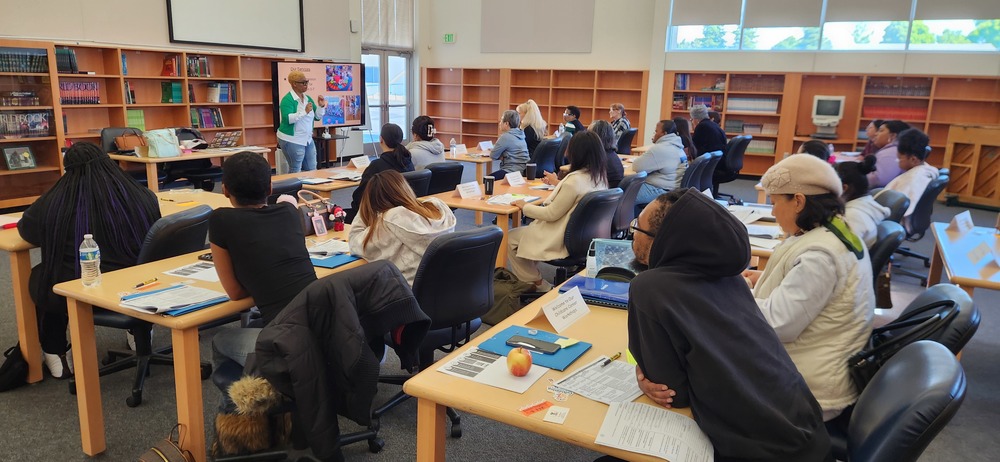 A group of adult learners engaged at a childcare careers class