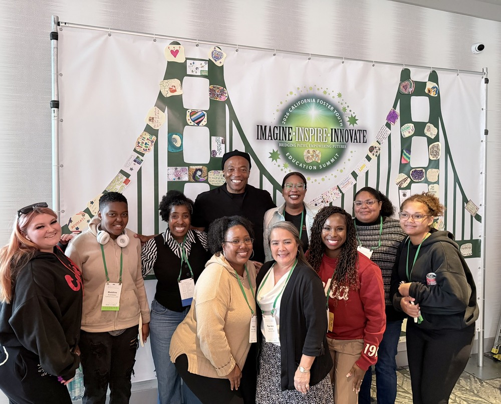 Students posing with staff the Summit