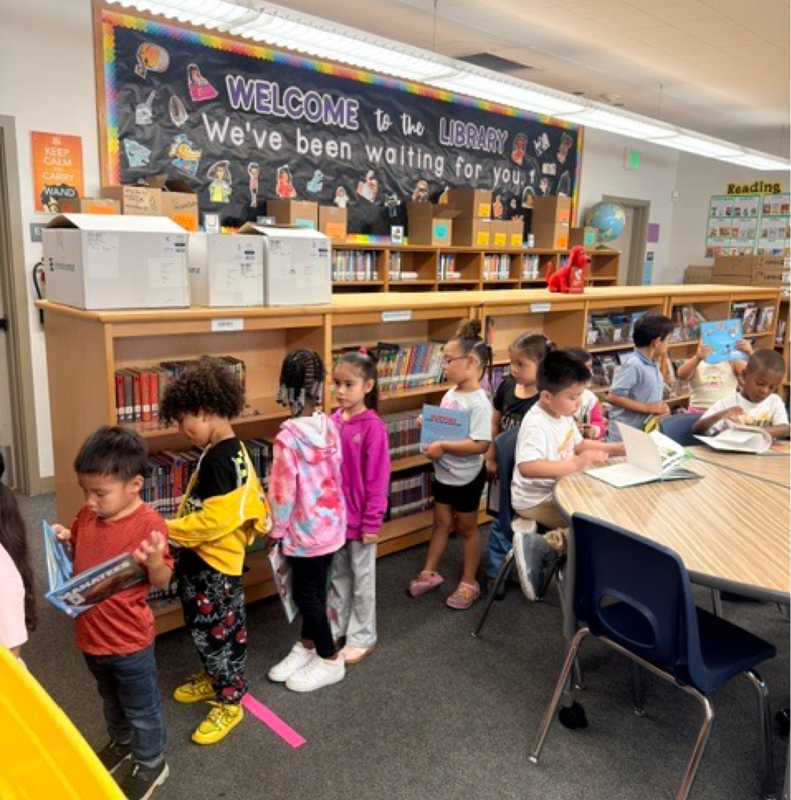 Welcome to the Library - A line of kids in the library