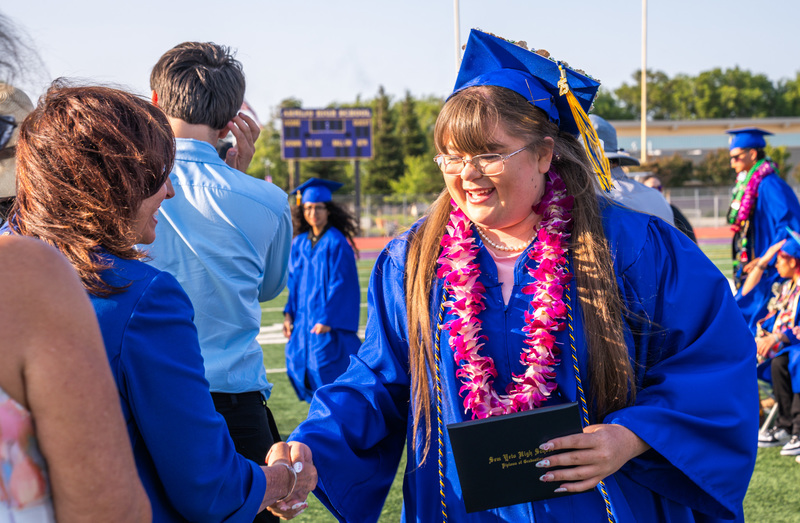 Student shaking the superintendent's hand