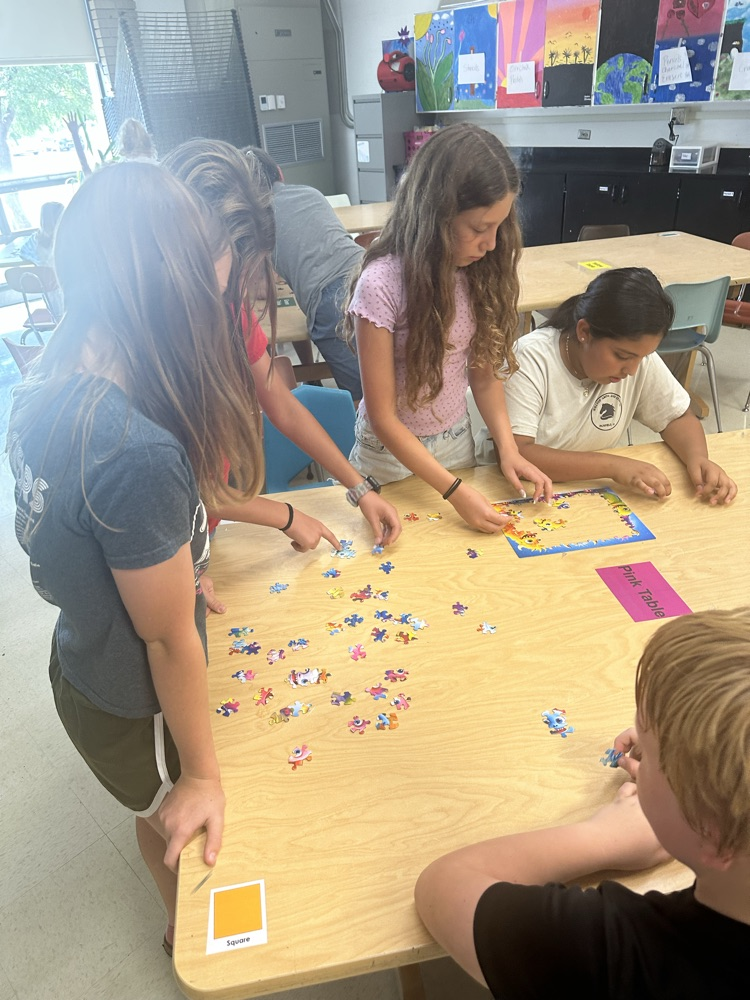 students doing puzzle
