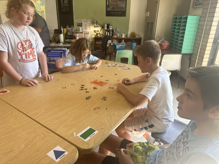 students doing puzzle