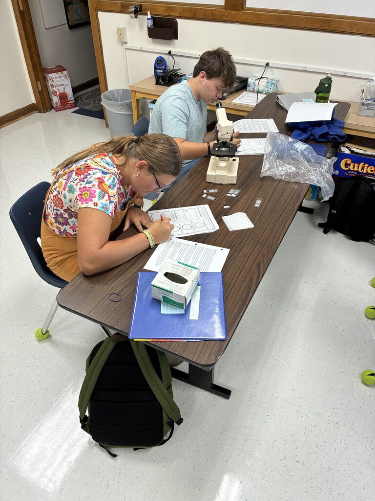Forensics Students investigating with microscopes - Sept 2026