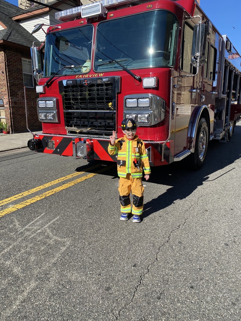 One of our students stole the show on Fire Safety Day, proudly showing off their firefighter gear!