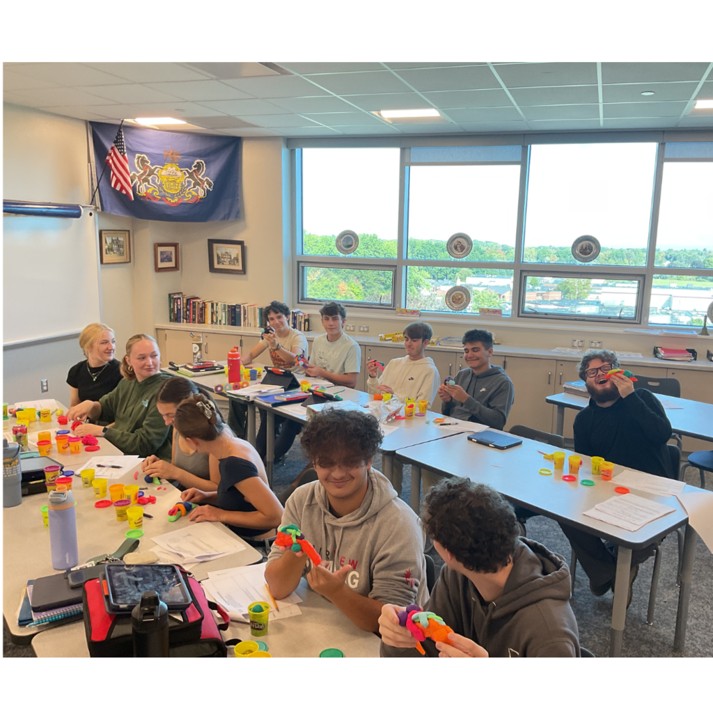 11 students making Play-Doh brains