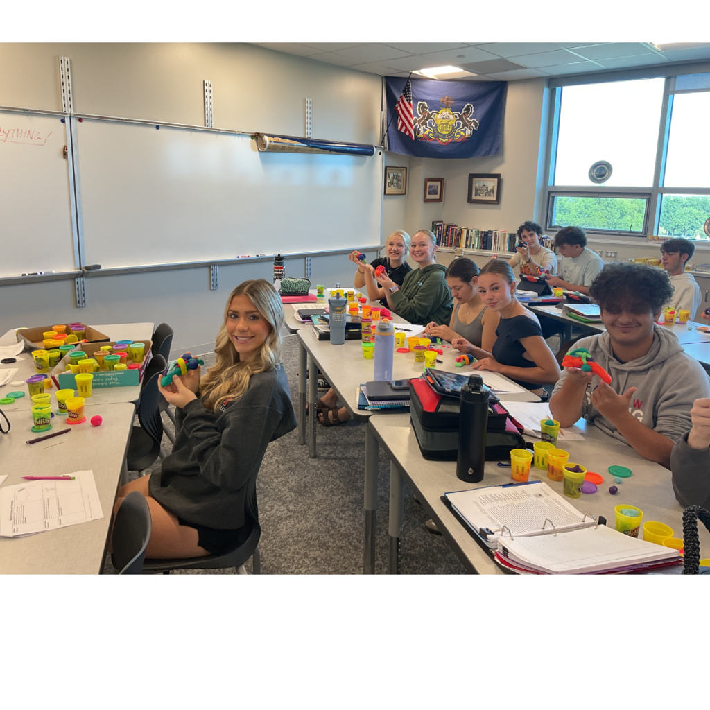 Class of 9 students making Play-Doh brains