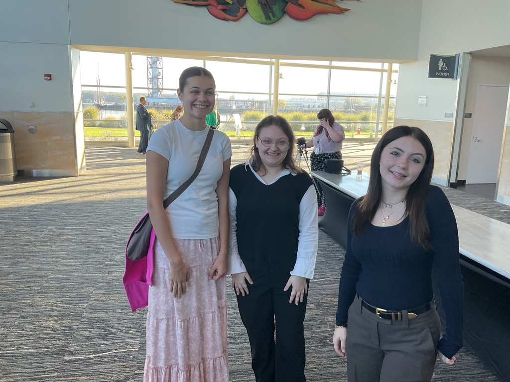 3 female students standing and smiling