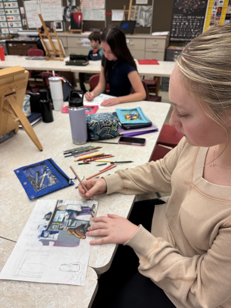 student using colored pencils