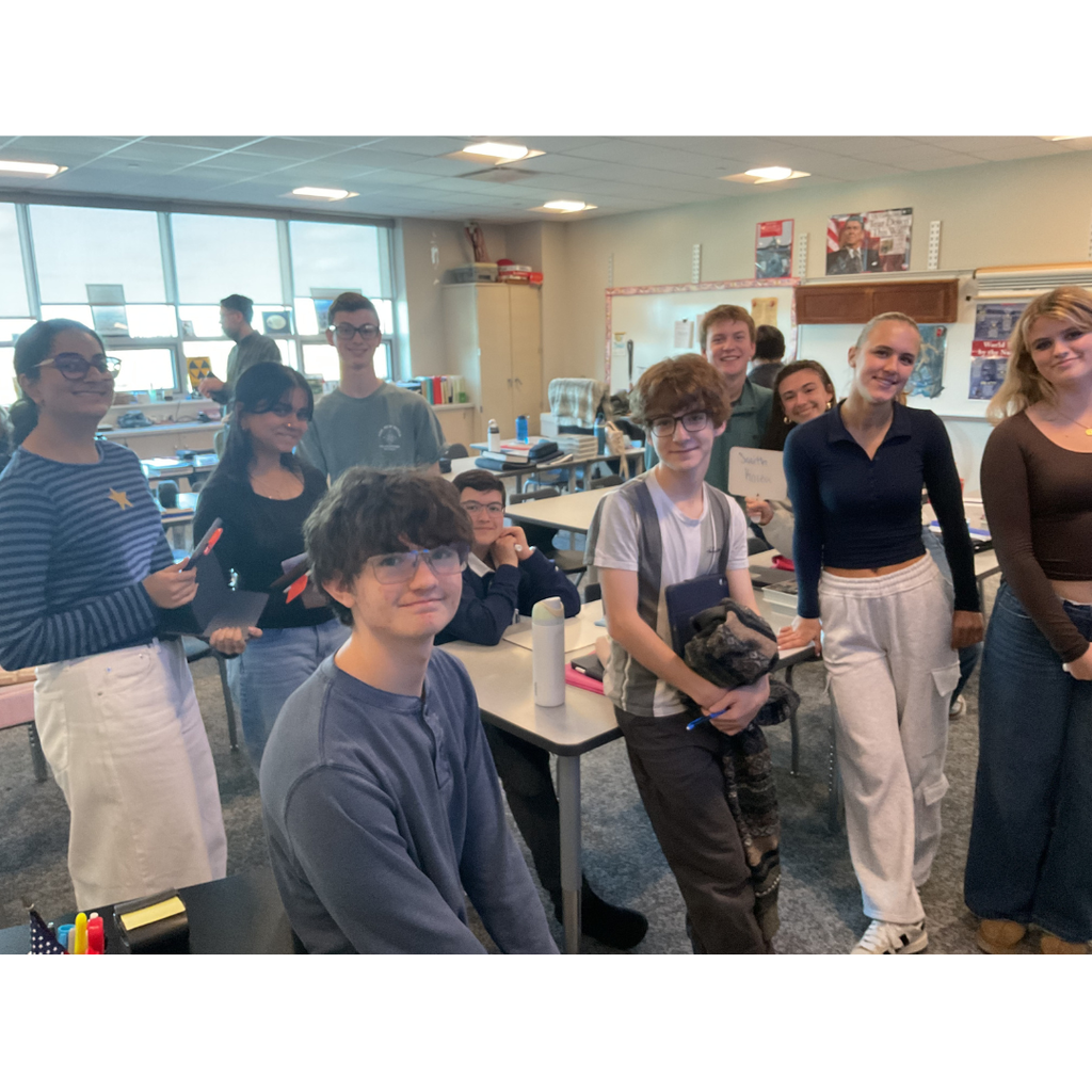 students standing smiling at the camera