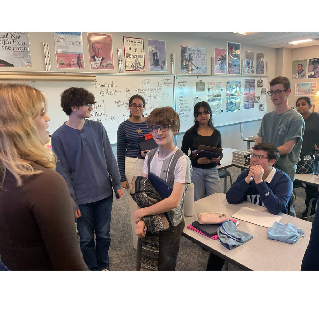 students standing and discussing