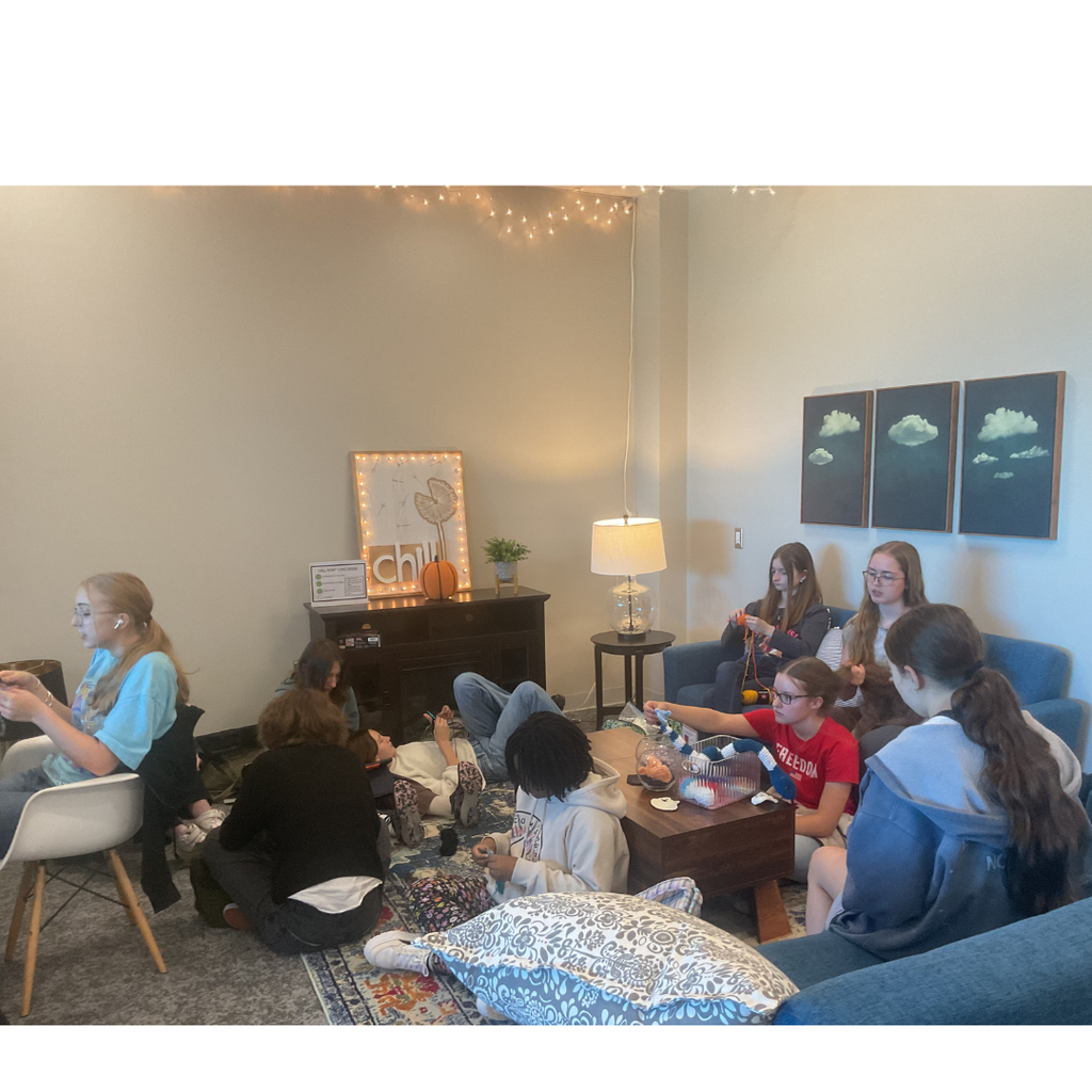 group of student crocheting