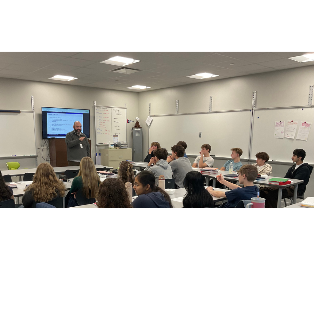 students listening to a guest speaker