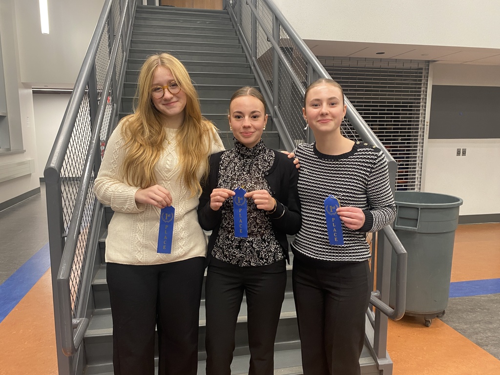 3 students holding ribbons