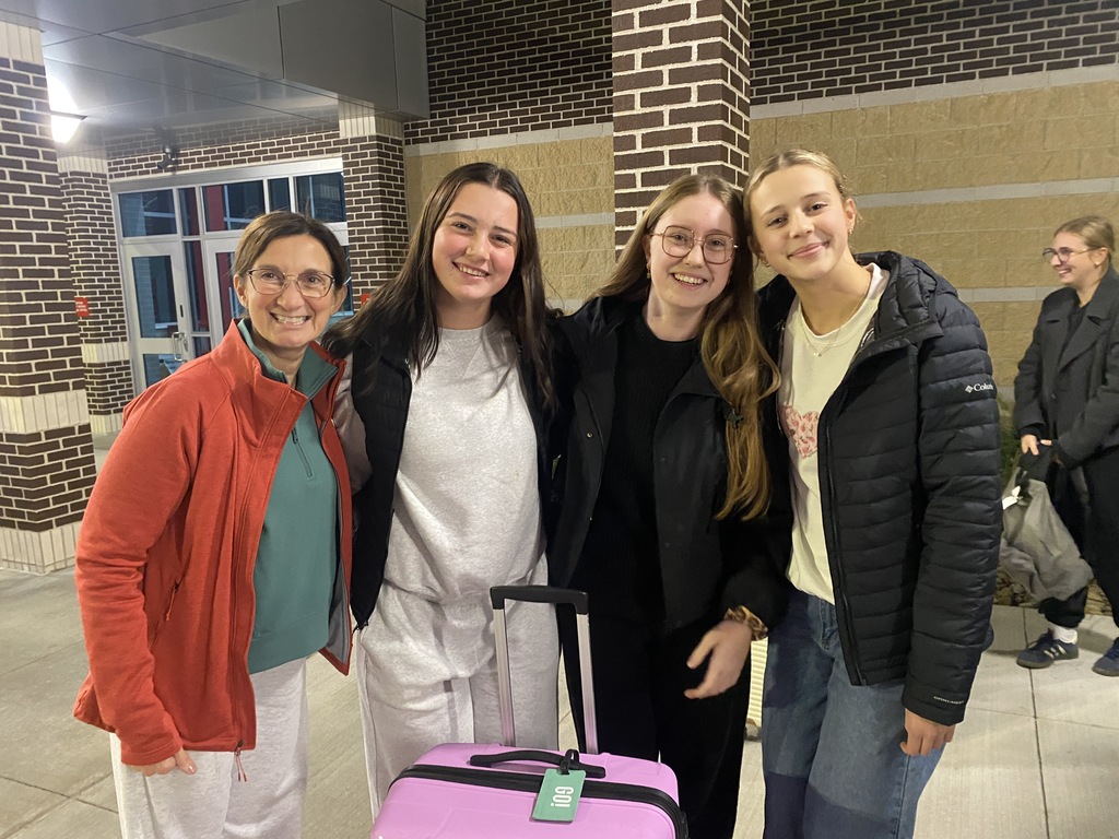 4 people saying goodbye