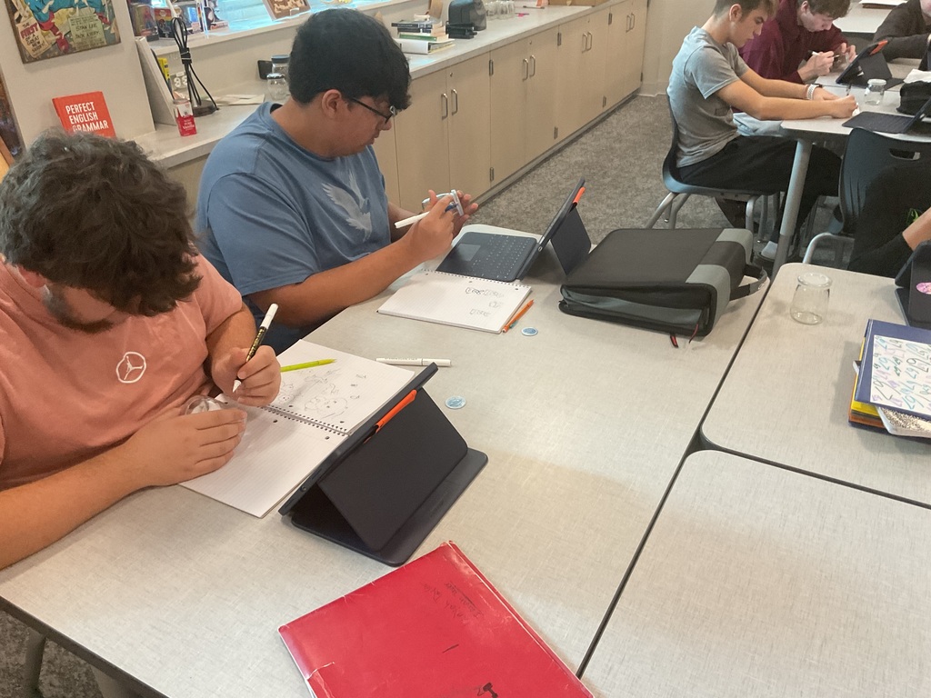 students painting a glass
