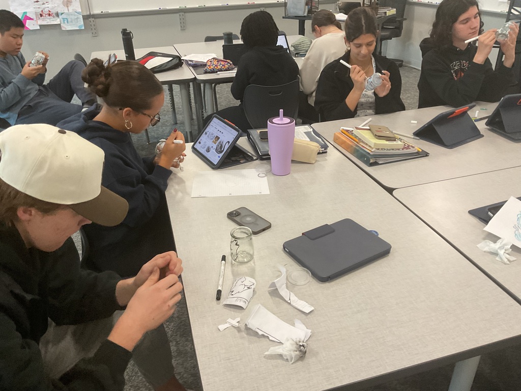 students painting a glass