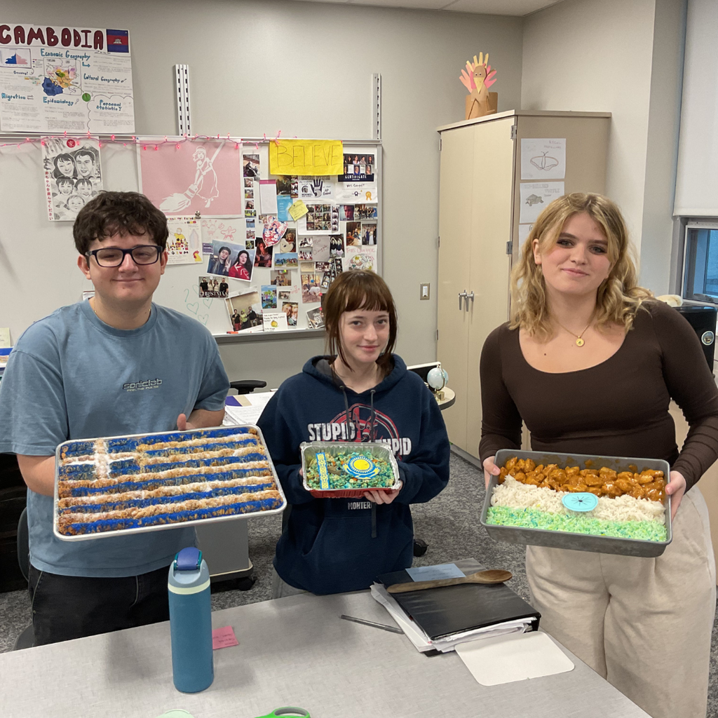 student holding a flag made out of food