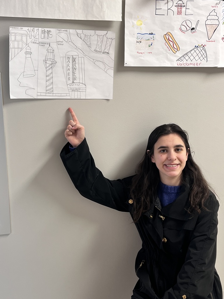 student pointing to poster