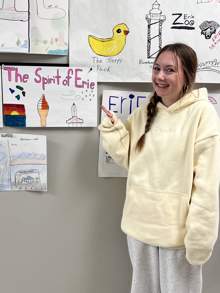 student pointing to poster