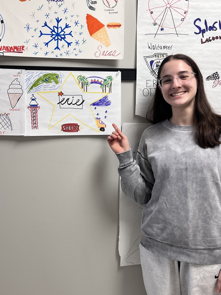 student pointing to poster