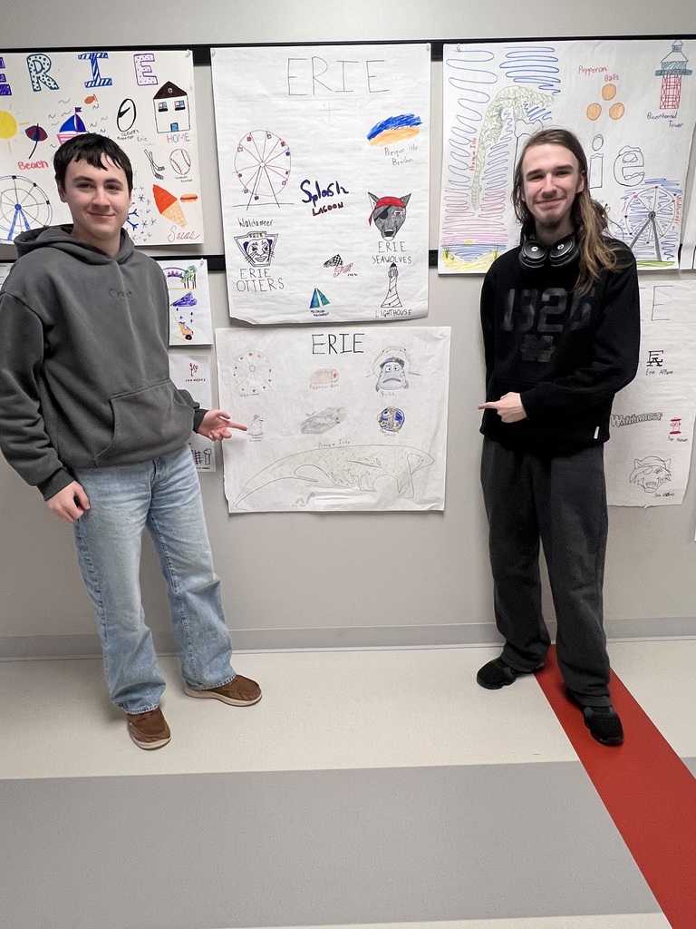 student pointing to poster