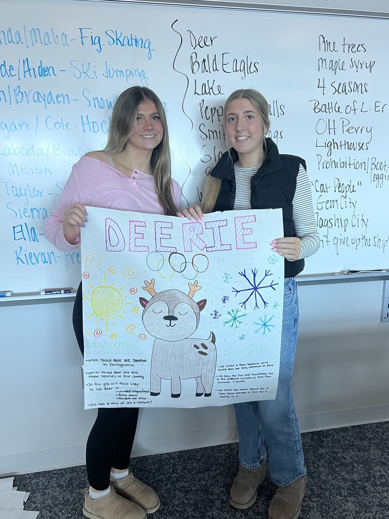 2 students holding a poster