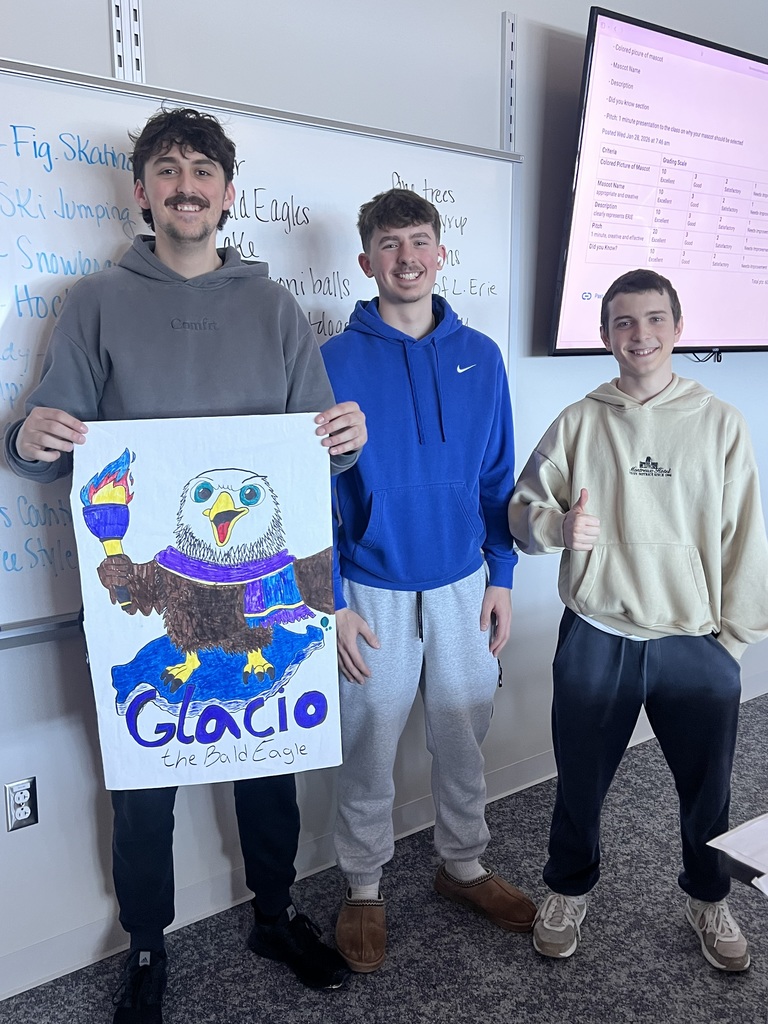 3 students holding a poster