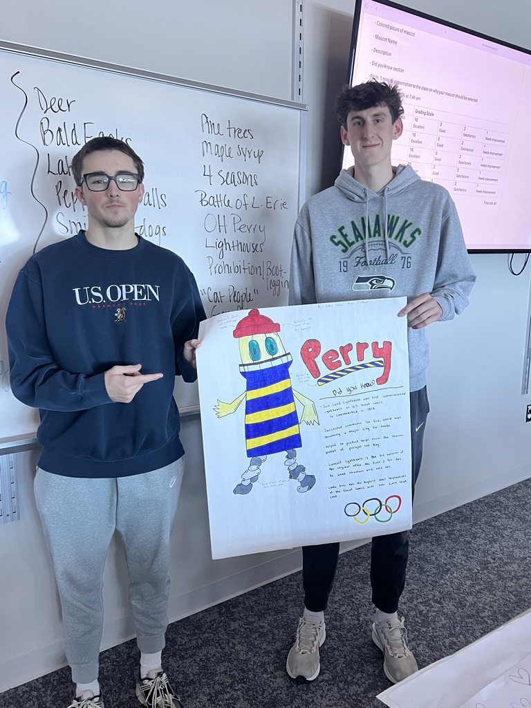 2 students holding a poster