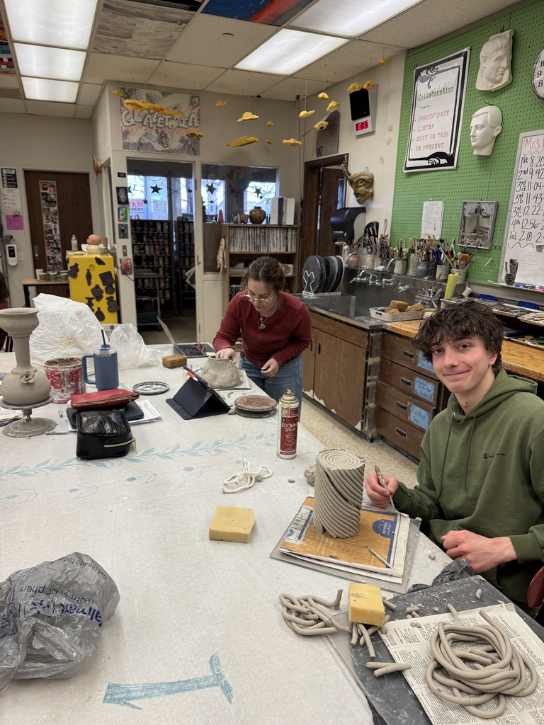 The students in the advanced ceramic class thrive while working on their independent projects.